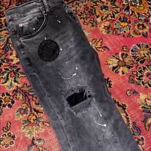 Black painted distressed jeans
